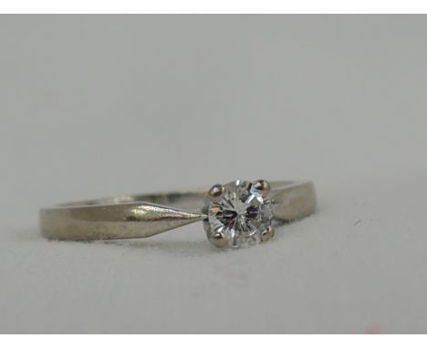 A lady's diamond solitaire dress ring .25ct in claw mount on an 18ct white gold loop,  size K/L