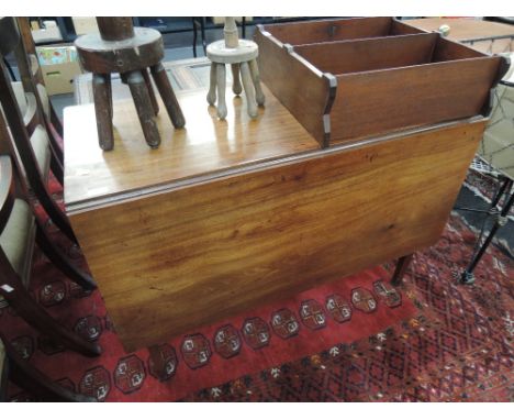 A 19th century mahogany dining table having rectangular drop leaf top on square tapered gate legs