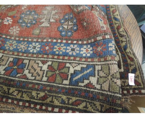 An early 20th century carpet square of Turkish design having red and blue ground