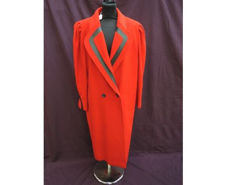 A lady's 1980's red wool and cashmere coat by Mansfield having black leather trim to shawl collar,  size 16