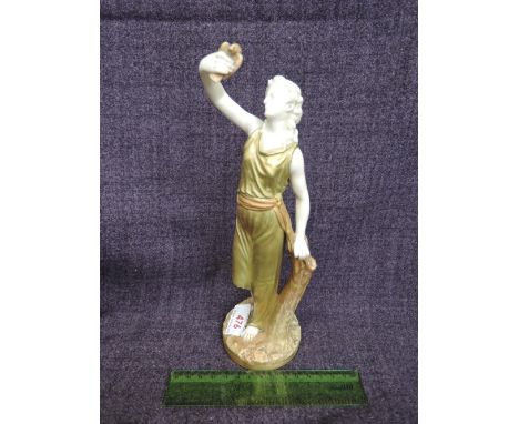 A Royal Worcester blush ivory figure modelled as classical Greek lady holding aloft a bird shape, number 2/166