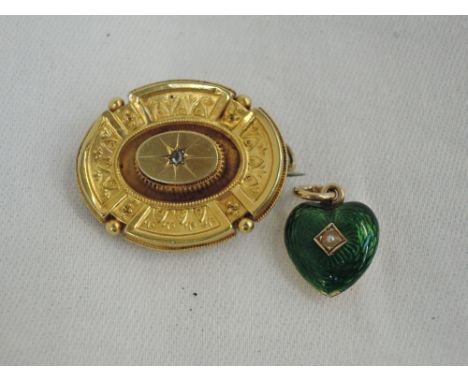 A yellow metal mourning brooch having a diamond chip to centre with wire work decoration, no marks tested as 18ct gold, and a