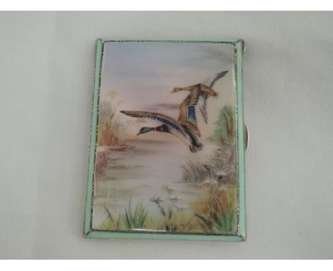 A silver cigarette case having an enamelled panel to front depicting Mallard ducks in flight within a decorative guilloche en