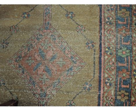 An early 20th century carpet runner of Turkish style having brown, blue ground, 105'x33'