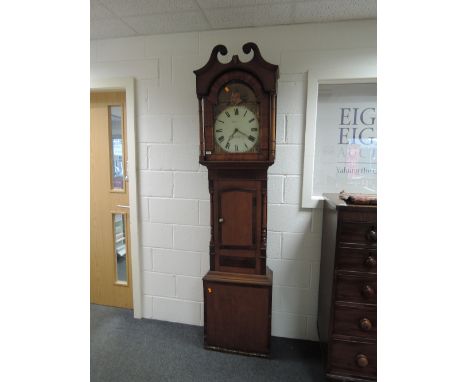 An early 19th century oak and mahogany longcase clock having pillar and swan neck hood containing painted arch dial for J H M