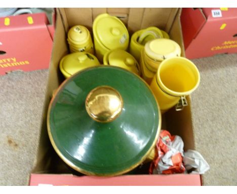 Large ceramic pot and cover with wooden contents and a quantity of lemon coloured storage jars etc