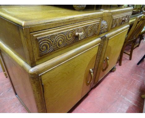 Light oak sideboard with carved drawers and two base cupboards