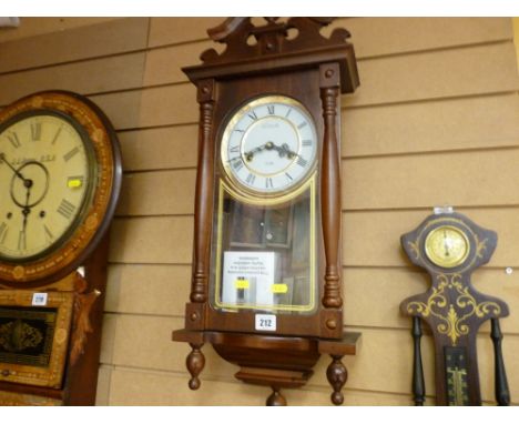 Well maintained modern thirty day pendulum wall clock and a clock and barometer combination
