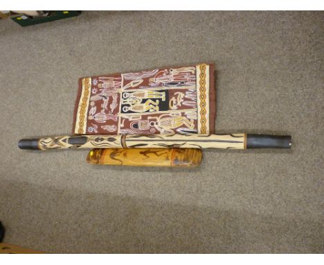 Three modern Australian Aborigine decorated items including a didgeridoo, decorative panel and a hand shield