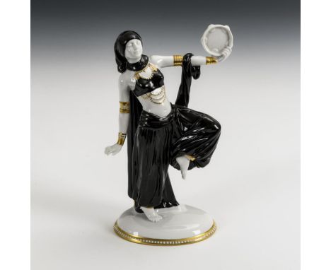 Tänzerin mit Tambourin    Sitzendorf.        Stempelmarke, 2. H. 20. Jh.                    In Schwarz und Gold bemalt.      