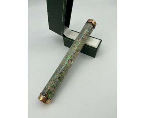 A Rare 19th century Antique glass cylinder containing a large quantity of opal chips. Finished with gold ends. [20cm in lengt