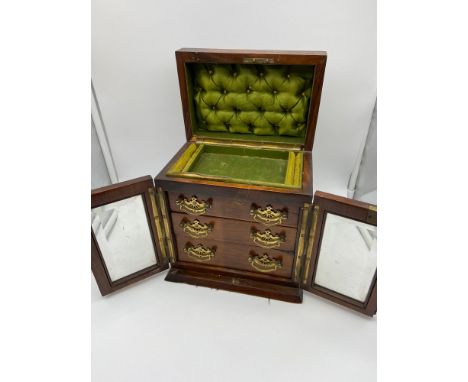 A Lovely example of a 19th century walnut jewel box. Designed with shield plaque and lift up lid, Two bevel glass and wood do