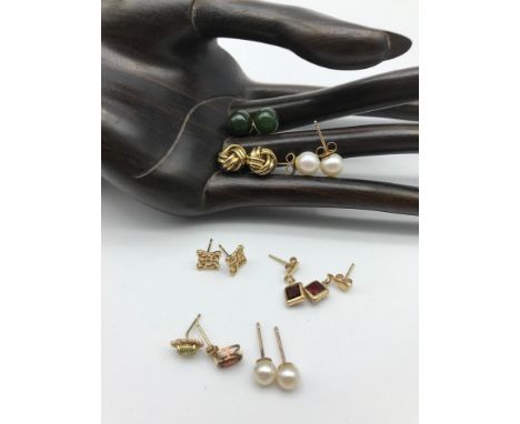 A Lot of 9ct gold earrings to include Jade, Garnets, Pearls and Celtic design earrings. Includes 6 pairs. [Total weight 9.6gr