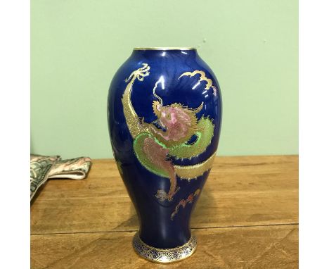 A Vintage Carlton ware dragon with clouds, blue background vase. [20cm in height] 