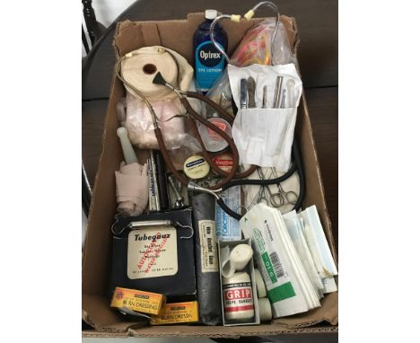 A Box containing vintage medical equipment to include Milliard Glasgow Stethoscope, Mercury filled thermometer, Various banda