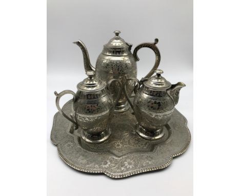 A 20th century Islamic style etched tea service with matching tray. 