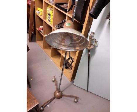 An unsual vintage Hanova Lamp with rise and fall function on three spider legs with period caster wheels. 