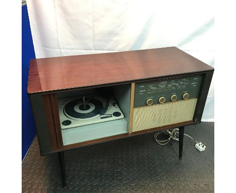 A Vintage Consort Radio cabinet fitted with a BSR Turntable. Designed on pedestal legs, Not tested. Measures 65x91x40cm 