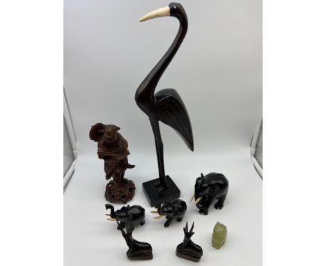 A Lot of various carved collectables which includes Large Bird, Three Elephants, Two antelopes, possible carved jade cat and 