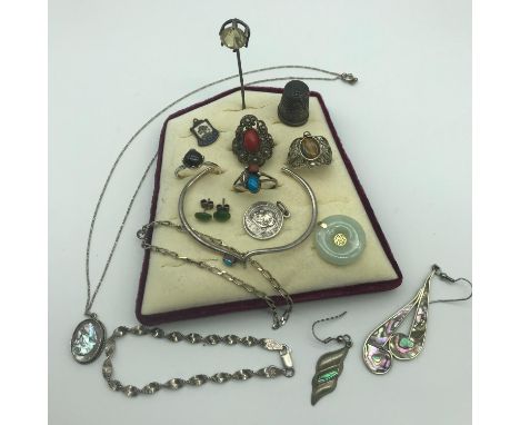 A Collection of silver jewellery and silver items to include Sterling silver thimble, Silver 925 bracelets, Silver bangle wit