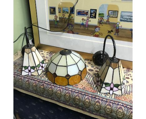Two Tiffany style wall hanging light fittings together with a Tiffany style shade. 