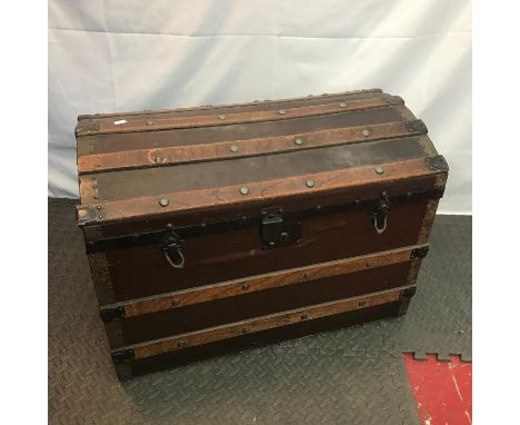 Antique saratoga travel trunk. Designed with wooden bounds. 