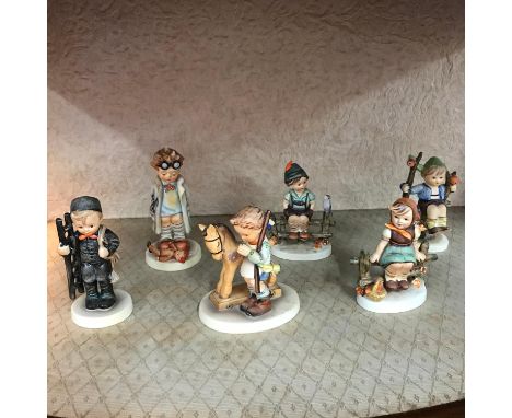 A Lot of 6 vintage/Antique Hummel Goebel figures, To include boy and horse, Boy and Girl sitting on the fences both dated 193