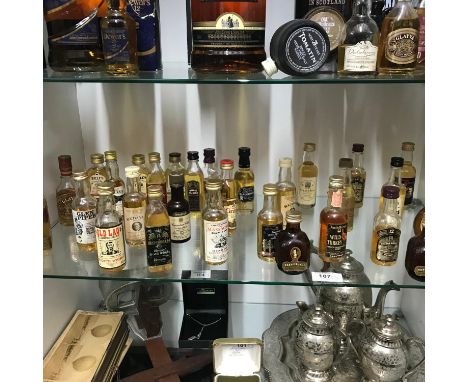 A Shelf of collectable whisky miniatures [All sealed] to include Johnnie Walker Red Label, Bells, Glen Piper, Old Lag, Ronson