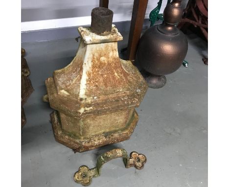 A large Victorian cast iron gutter hopper with bracket.