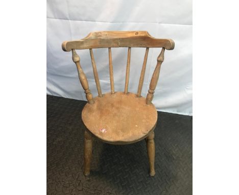 Antique light wood child's spindle back chair. 