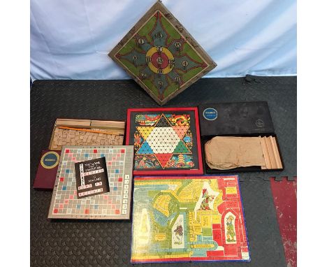 A Lot of vintage board games to include Scrabble, Chad Valley peg board game, Old Alice in wonderland board game [no accessor