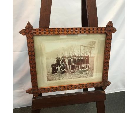 A Vintage photograph of Mellerstain Football Club. Possibly early 1920's. Fitted within an arts and crafts frame. 