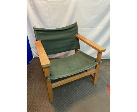 A Retro light wood and green canvas relaxer chair. 