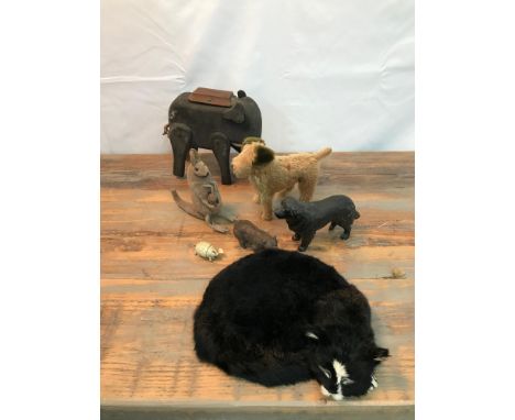 A Collection of antique and vintage collectors toys to include a Wooden hand made elephant figure with moving limbs and trunk