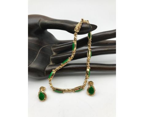 A 14ct gold and Jade/Jadeite gem stone bracelet with matching earrings. Weighs 12.94grams. 