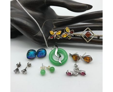 A Lot of silver jewellery to include 925 silver and amber brooches, Silver and amber butterfly earrings, Jade and silver pend