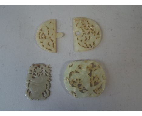 Two Oriental Carved Jade Buckles and a Pendant. 
