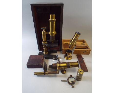 A Cased Brass and Iron Microscope (No Eyepiece), A Cased Field Microscope and One Other.