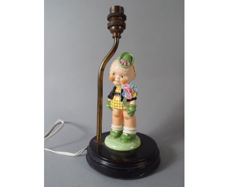 A Mabel Lucie Attwell Ceramic Table Lamp by Shelley in the Form of a Girl with Bonnet and Flowers. 