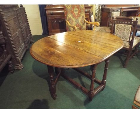 An Early Oak Topped Drop Leaf Gate Leg Table with End Drawer. 