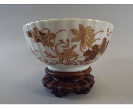 A Gilt and Brown Enamel Floral Decorated Oriental Ribbed Bowl on Turned Wooden Stand with Five Feet. 13.5cm Diameter. 
