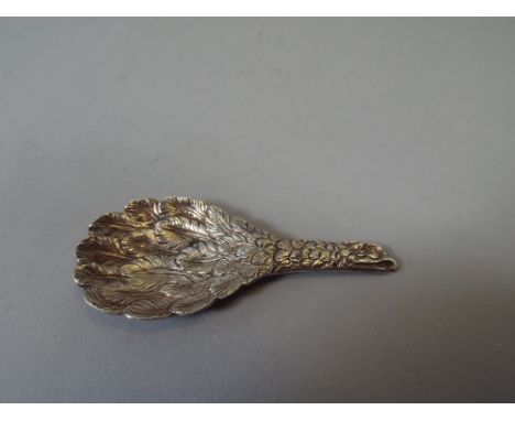 An Interesting White Metal Novelty Tea Caddy Spoon, The Handle with Embossed Eagle Head Decoration and the Bowl with Feathers