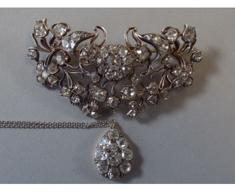 A Late 19th Century Diamond Set Foliate Brooch having Centre Cluster, Crescent Shaped Panel and Articulated Pear Shaped Drop 