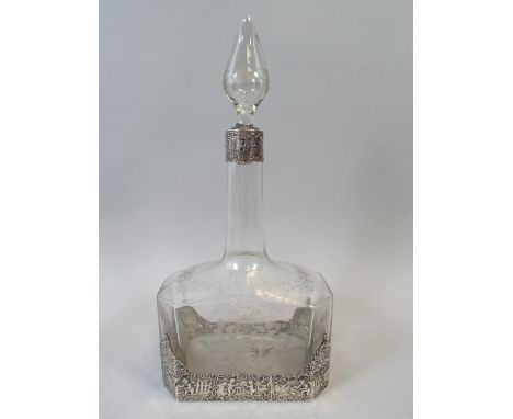 A Good Quality Continental Silver Mounted Etched and Cut Glass Decanter. The Mounts Decorated in Relief with Cherubs Hunting 