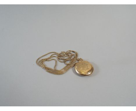 A 9ct Gold Pendant Powder Compact. The Hinged Lid Monogrammed E.M on the 9ct Double Box Chain with Original Duster. 25.8g