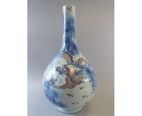 A Large Chinese Bottle Vase Decorated in Blue and Red Enamels with Dragon Chasing Pearl. (Chip to Rim) 47cm High