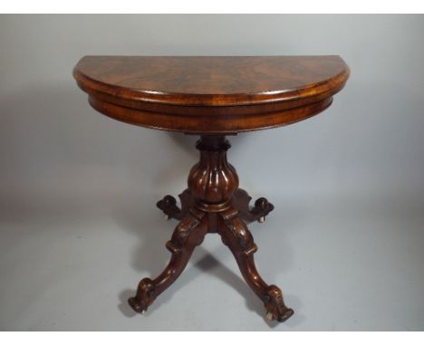 A Mid Victorian Burr Walnut Demi Lune Lift and Twist Games Table having Green Beize Playing Surface.91x44cm (Closed)