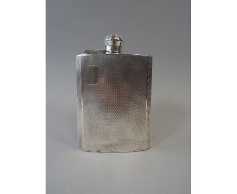 A Silver Hip Flask. The Body with Engine Turned Decoration, Hinged Lid with Inner Cork Stopper. 14cm High. B'ham 1948. 210gms