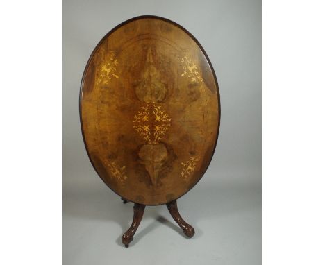 A Victorian Inlaid Walnut Oval Snap Top Table on Quadrant Extended Birdcage Support with Turned Finial and Carved Scroll Feet