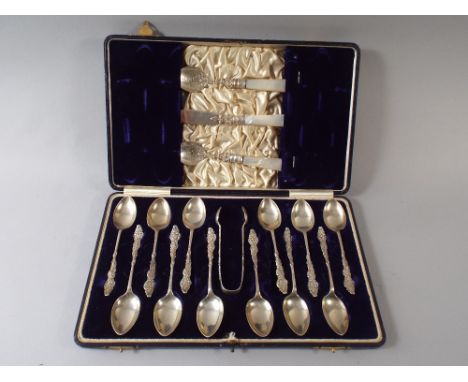 A Cased Silver Set of 12 Teaspoons, Sugar Bow, Two Mother of Pearl Handled Preserve Spoons and a Mother of Pearl Handled Butt